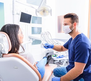 Dentist and patient talking in dental office