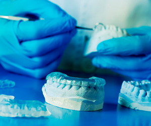 a dental lab technician creating an occlusal splint